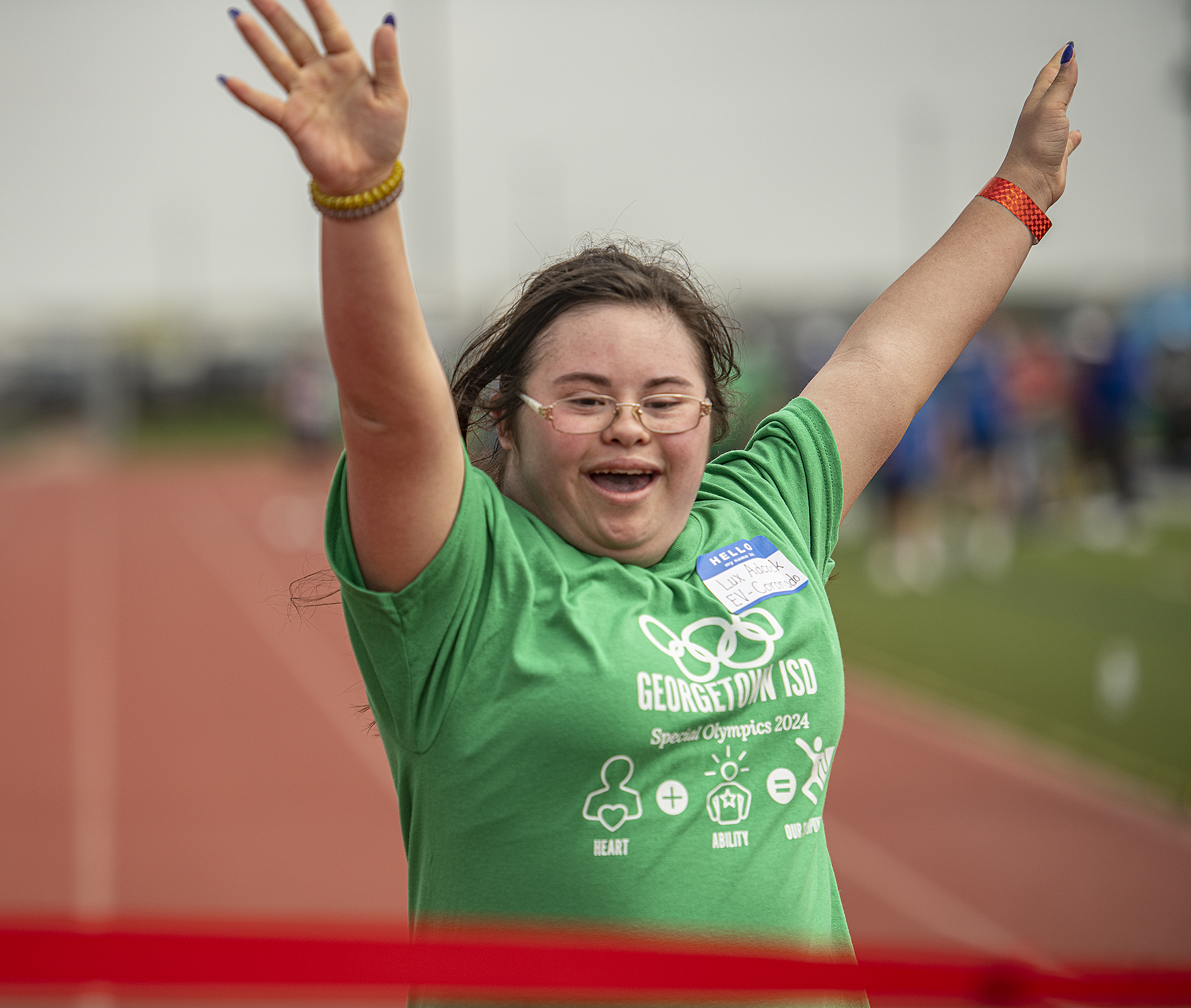 East View High student Lux Adcock finishes a race during  the Georgetown Independent School District's annual Special Olympics, held Tuesday, May 7, 2024  at the district sports complex behind Georgetown High School.     Photo by Andy Sharp. 