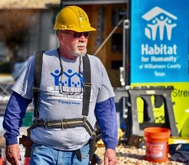 Ed Harmes on the job volunteering at Habitat for Humanity.