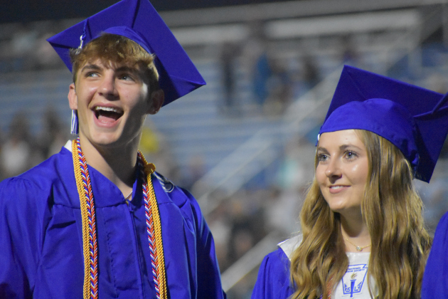 Tyler Seaman and Jaylee Schovajsa stand during the Graduation ceremony. 