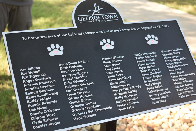The commemorative plaque includes the names of all 75 dogs lost in the 2021 fire at the Ponderosa Pet Resort.
