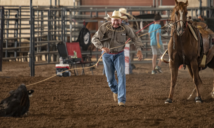 Llew Rust of Stephenville, Texas competes in Tiedown Roping.