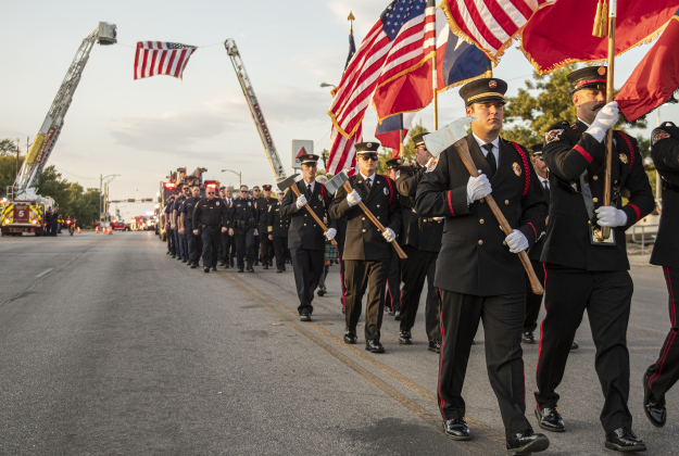 Parade participants march along Main Street during Taylor's Patriot Day observance on Monday, September 11, 2023.  