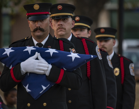 Members of the Taylor Honor Guard prepare to post the colors at Heritage Square Park during Taylor's Patriot Day observance on Monday, September 11, 2023. 