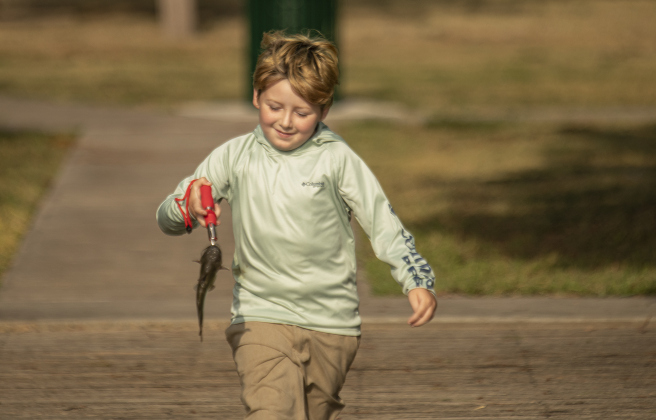 9-year-old Johnny Hurley is seen with one of several fish he caught.