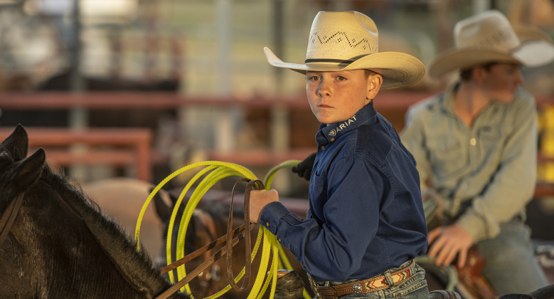 12-year-old Beau Taylor prepares to compete in Team Roping.