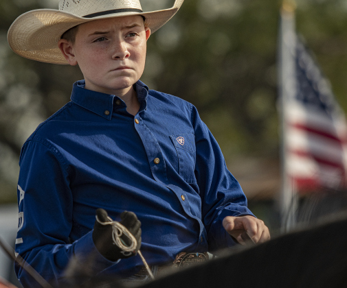 12-year-old Beau Taylor puts on his game face before competing in Breakaway Roping.