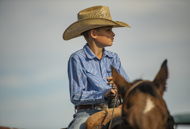 11-year-old Trigg Isbell, astride his horse named Socks,  gets ready for Breakaway Roping competition.