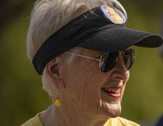 Judy Reinhart wore her duck earrings while cheering on the entrants  during the annual Duck Race held Saturday, October 21, 2023 at San Gabriel Park.   The annual event is a fundraiser for the  American Association of University Women (A.A.U.W.). 50 rubber ducks were released into the water in five separate heats.  The top winners in each heat were gathered together for a championship heat. 