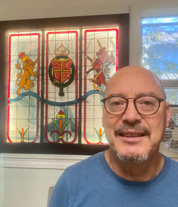 A stained glass window created by Jose “Papi” Parra is a fixture at Papi’s Pies restaurant in Round Rock.