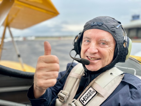 Army veteran Kent Cummins gives a thumbs up after his DreamFlights with Darryl Fisher.