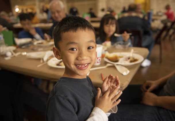 7-year-old Oliver Nguyen enjoyed spending time with his family at the Community Thanksgiving, held at the Georgetown Community Center in San Gabriel Park on Thursday, November 23, 2023.