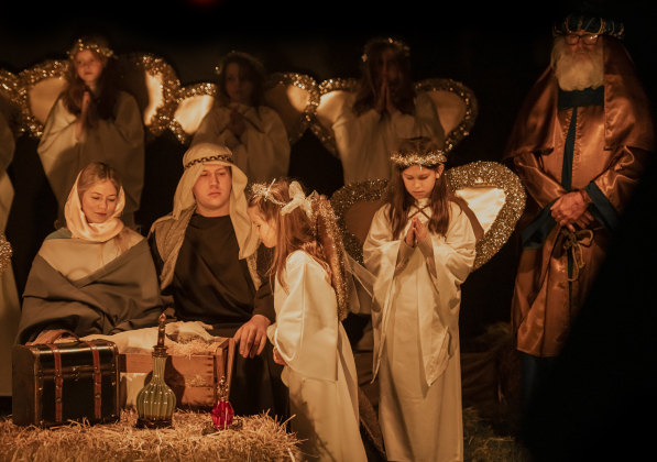 Participants perform the manger birth scene at  Immanuel Lutheran Church for their Pilgrimage to Bethlehem, the church's Live Nativity, on Saturday, December 9, 2023.