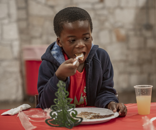 6-year-old Jullian Moye eats a pancake.