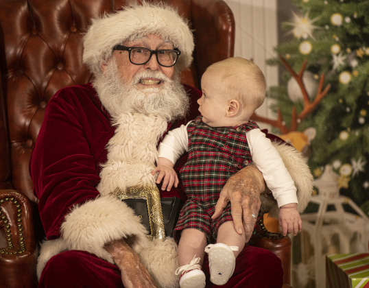Santa Claus visits with 8-month-old Jethro Brown.