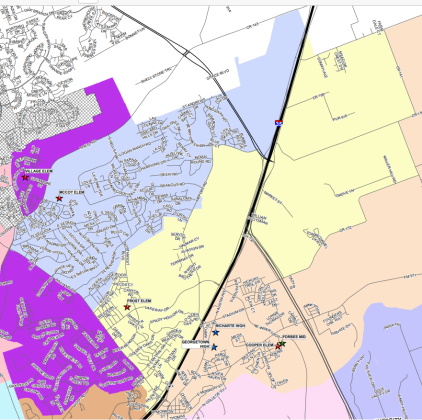 Frost Elementary School's attendance zone is highlighted in yellow, and McCoy Elementary School's attendance zone is in blue. 