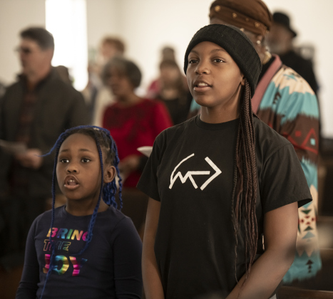 8-year-old Kyri Ogletree, left, and her sister Kennadi, 13, right, attended the Macedonia Baptist Church program  during the Dr. Martin Luther King, Jr. march and program held on Monday, February 19th, 2024.