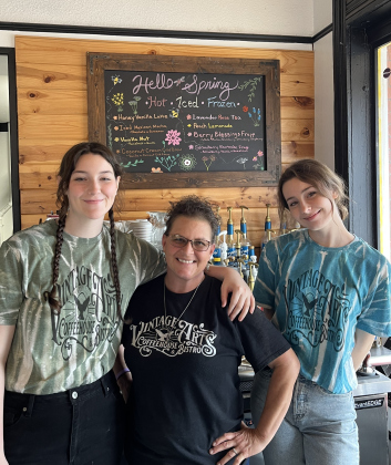Rachel Brunson, center, owner of Vintage Arts Coffeehouse and Bistro, with her sisterly staff — Hannah Booher (left) and Scarlett Booher.