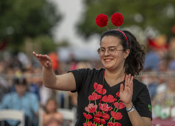 Lorena Ortiz enjoys the music of Dysfunkshun Junkshun  on  the opening night of the Red Poppy Festival on Friday, April 26.  Photo by Andy Sharp