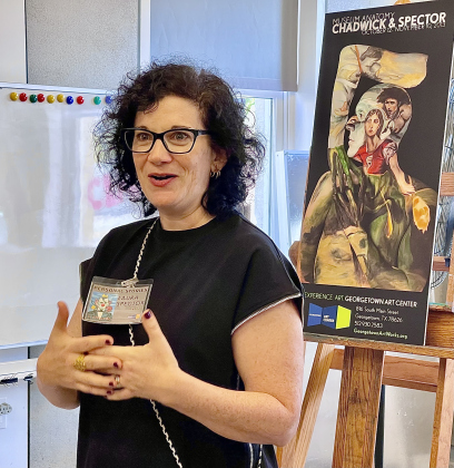  Laura Spector, the first artist to exhibit at the Georgetown Art Center when it opened in 2013, discusses her work at the Georgetown Art Works 10th anniversary reception August 19.  Photo courtesy David Valdez