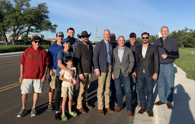 Officials gather to celebrate the opening of the newly conjoined roads of Verde Vista Drive and Williams Drive. From left are Hank Tovar, vice president of Heritage Oaks HOA, representatives from Culvers, Assistant City Manager Nick Woolery, Council Member Kevin Pitts, Mayor Josh Schroeder, Travis Wilkes, Kris Johnston and representatives from Savvy Development and Dexter Harmon, president of Heritage Oaks HOA. (Kaitlyn Wilkes)