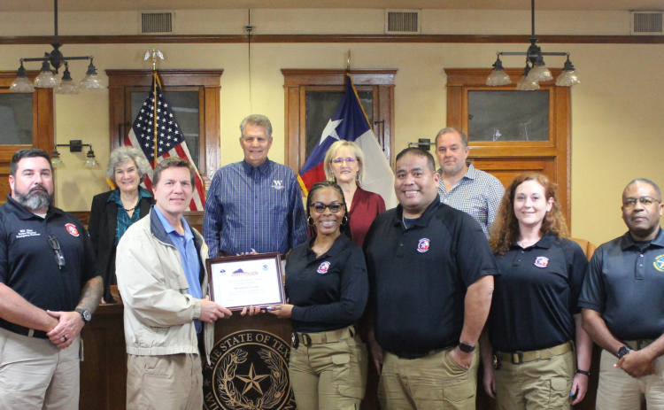 The Williamson County Office of Emergency Management stands with Paul Yura, left, and the county commissioners after being designated as a Storm Ready community. Photo courtesy of Williamson County.