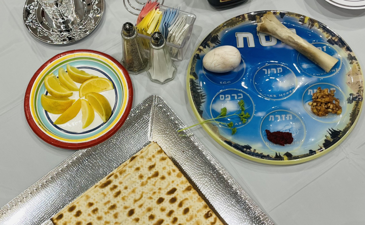 A photo shows a catered Seder Dinner. 