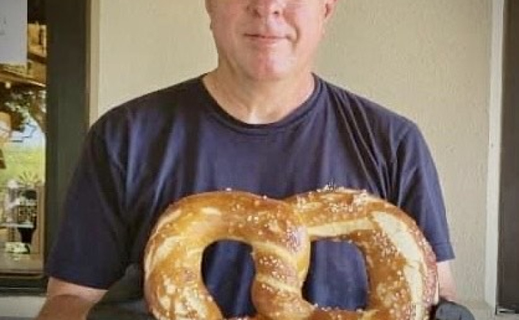H.L. Fahnestock at Rentsch Brewery Oktoberfest 2022 with a 2 1/2 lb pretzel he made for the event.