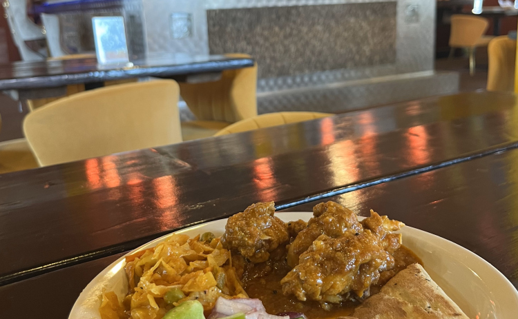 An order of Namaste’s Nepali style of Chicken Curry, Cabbage Masala, Kachumber salad and naan. 