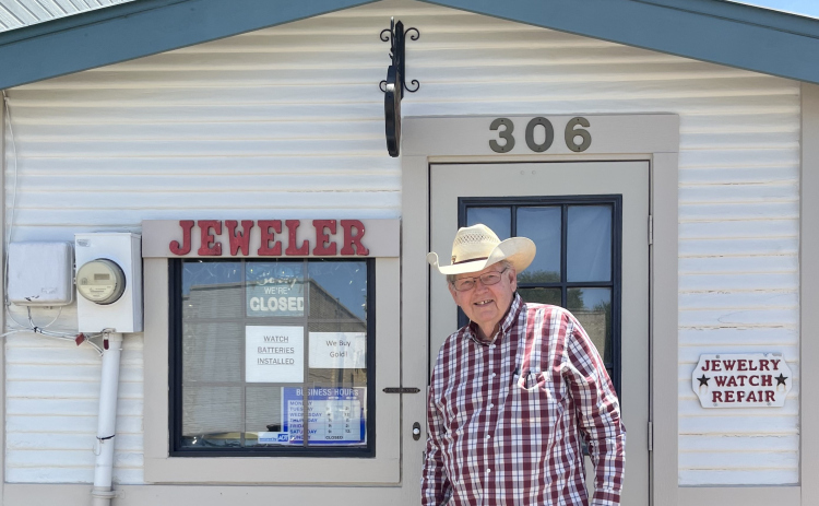 Linzy Bandy stands in front of his jewelry store and repair shop.