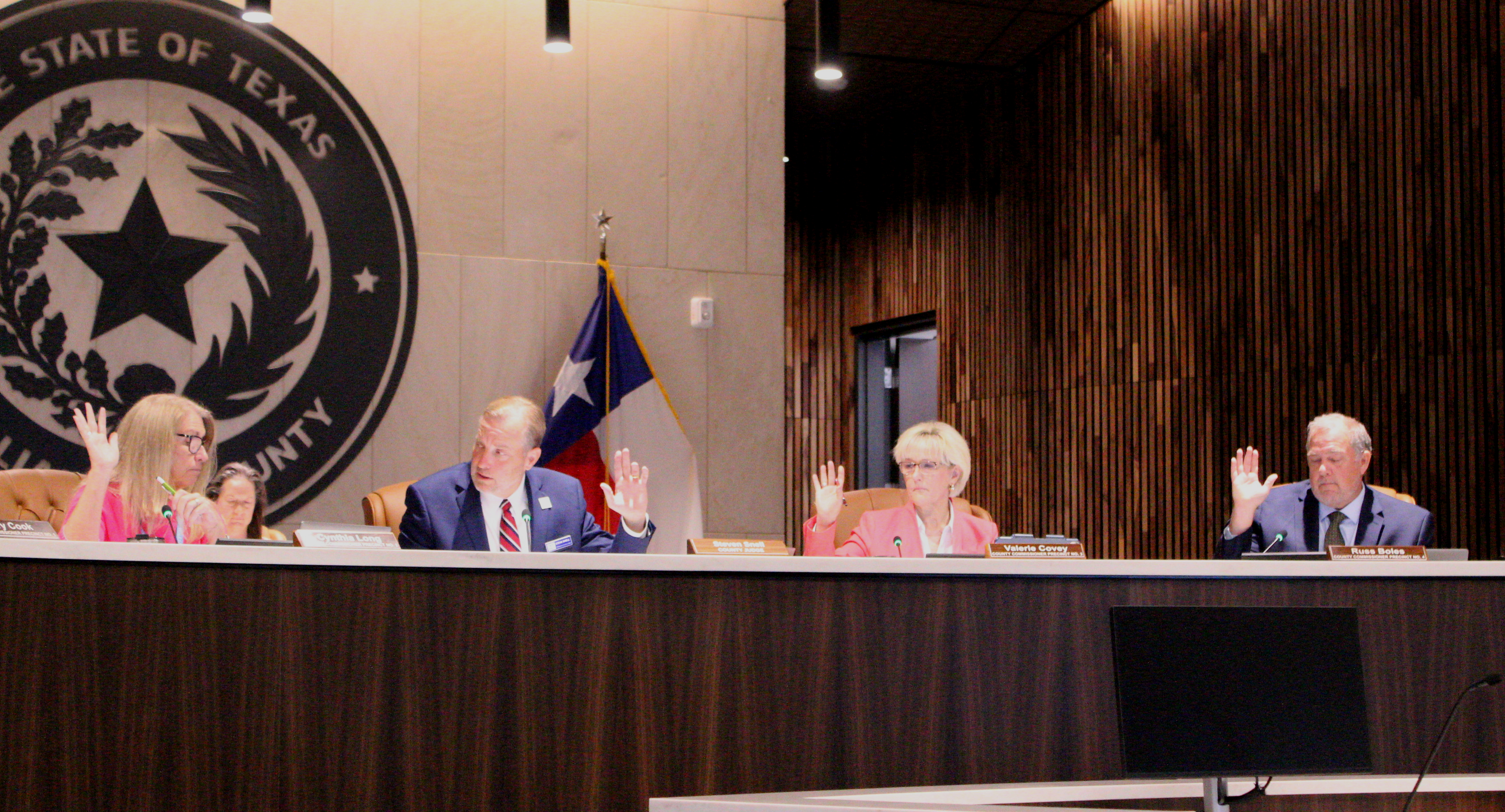 The Williamson County Commissioners approved supporting four Williamson County nonprofits by giving $200,000 each during the July 14 meeting. From left are Commissioner Cynthia Long, County Judge Steve Snell, Commissioner Valerie Covey and Commissioner Russ Boles. Photo by Nalani Nuylan.