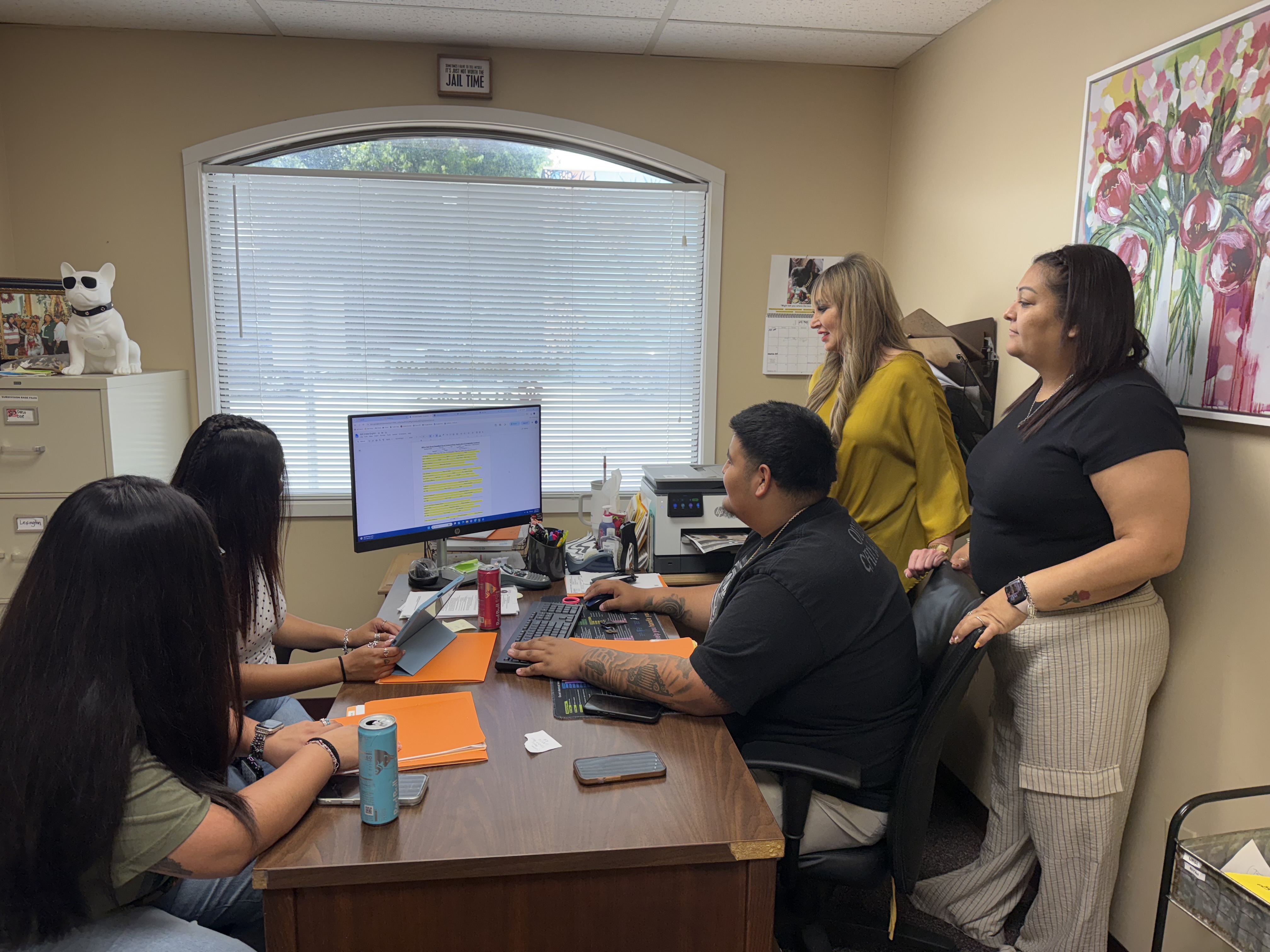 Bulldog Investigations bond runners America Villarreal, Mariyah Sosa and Marcus Honstein, along with office manager Ursula Morales, work with Jessica Zak, owner of Bulldog Bail Bonds. Photo by Abbey Archer