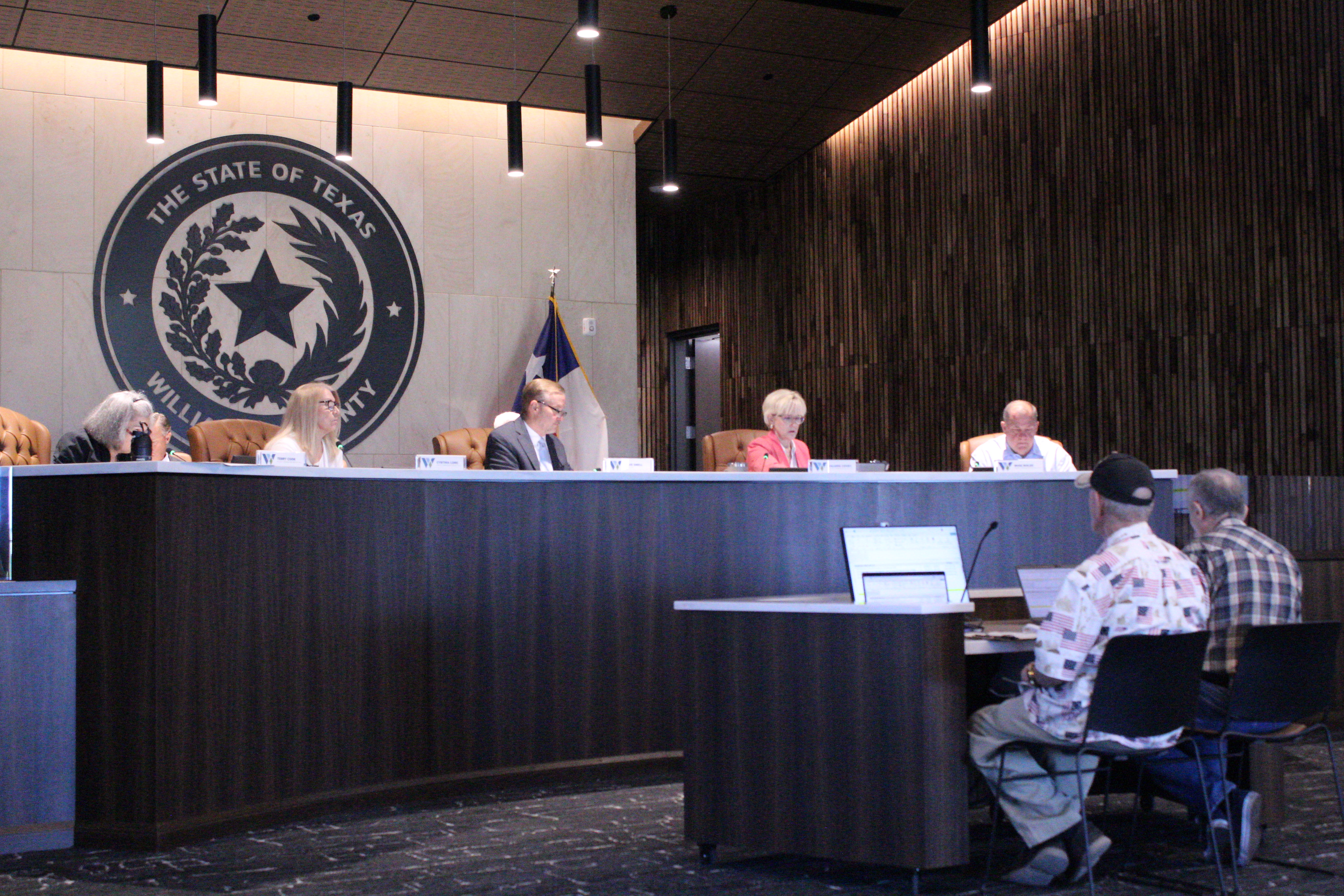 Williamson County resident Bill Kelberlau, front left, and Rick Litowski, right, ask questions about the Debt Service Fund for the county’s fiscal year 2026-2027 budget, September 1. Photo by Nalani Nuylan.