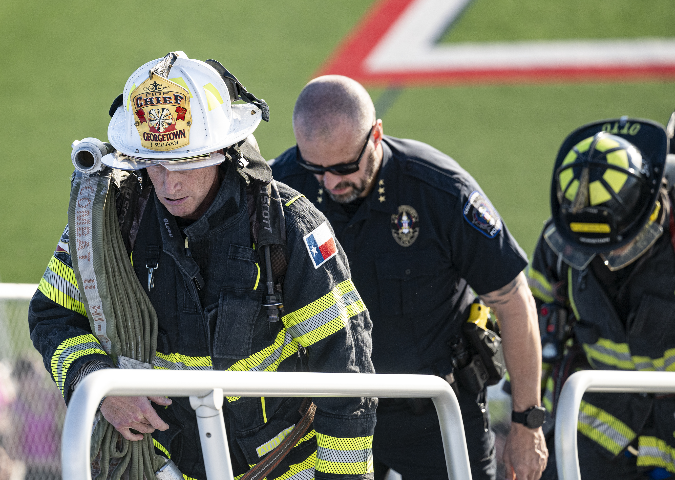 Georgetown Fire Department Chief John Sullivan, front, and Georgetown Police Department Chief Cory Tchida participate in the 2025 stair climb at the Georgetown High School football field. (Georgetown Fire Department)