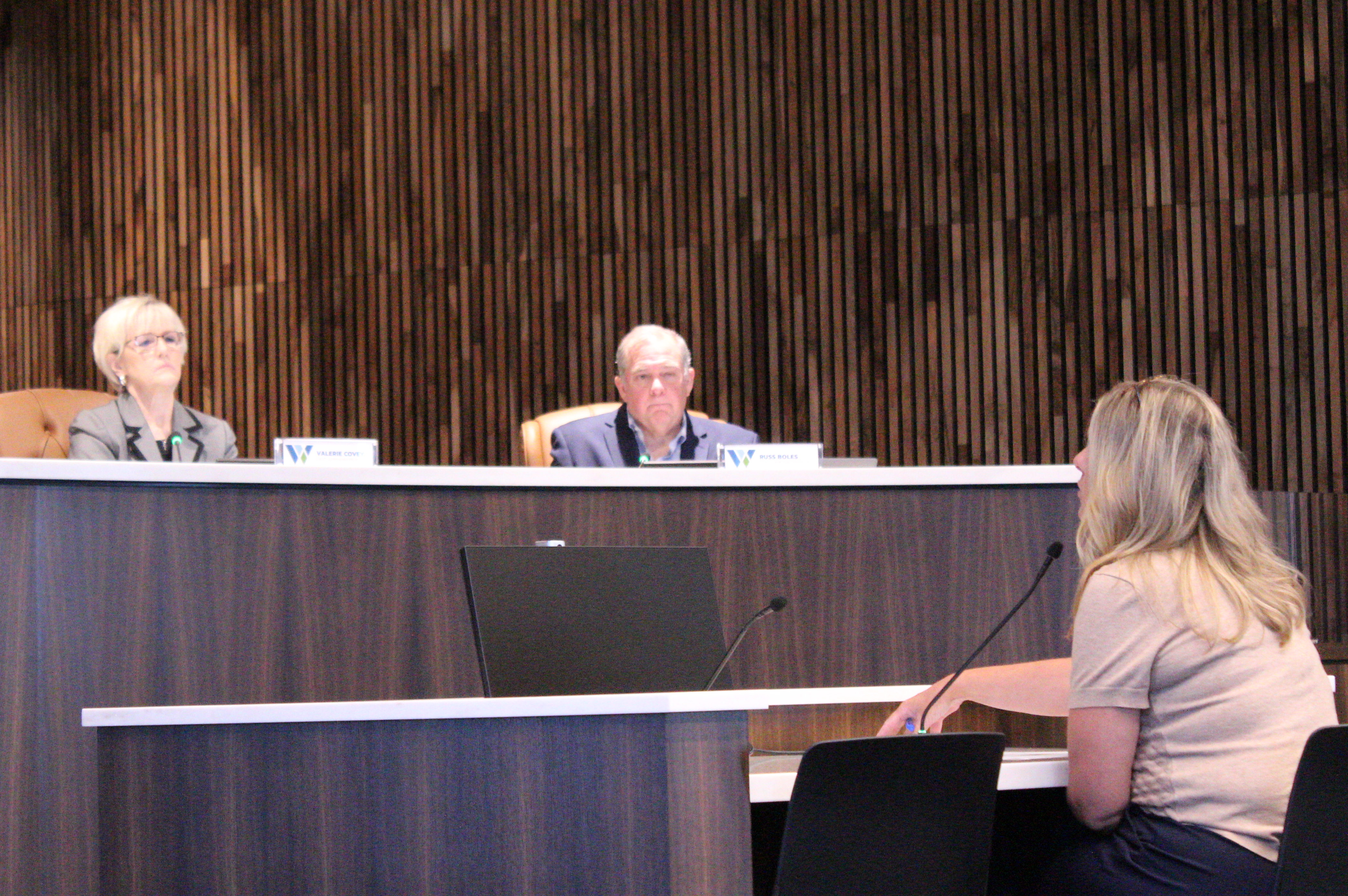 County Manager Rebecca Clemons (front) proposes three draft plans for future use of county facilities to county officials during the September 22 Commissioners Court. Photo by Nalani Nuylan