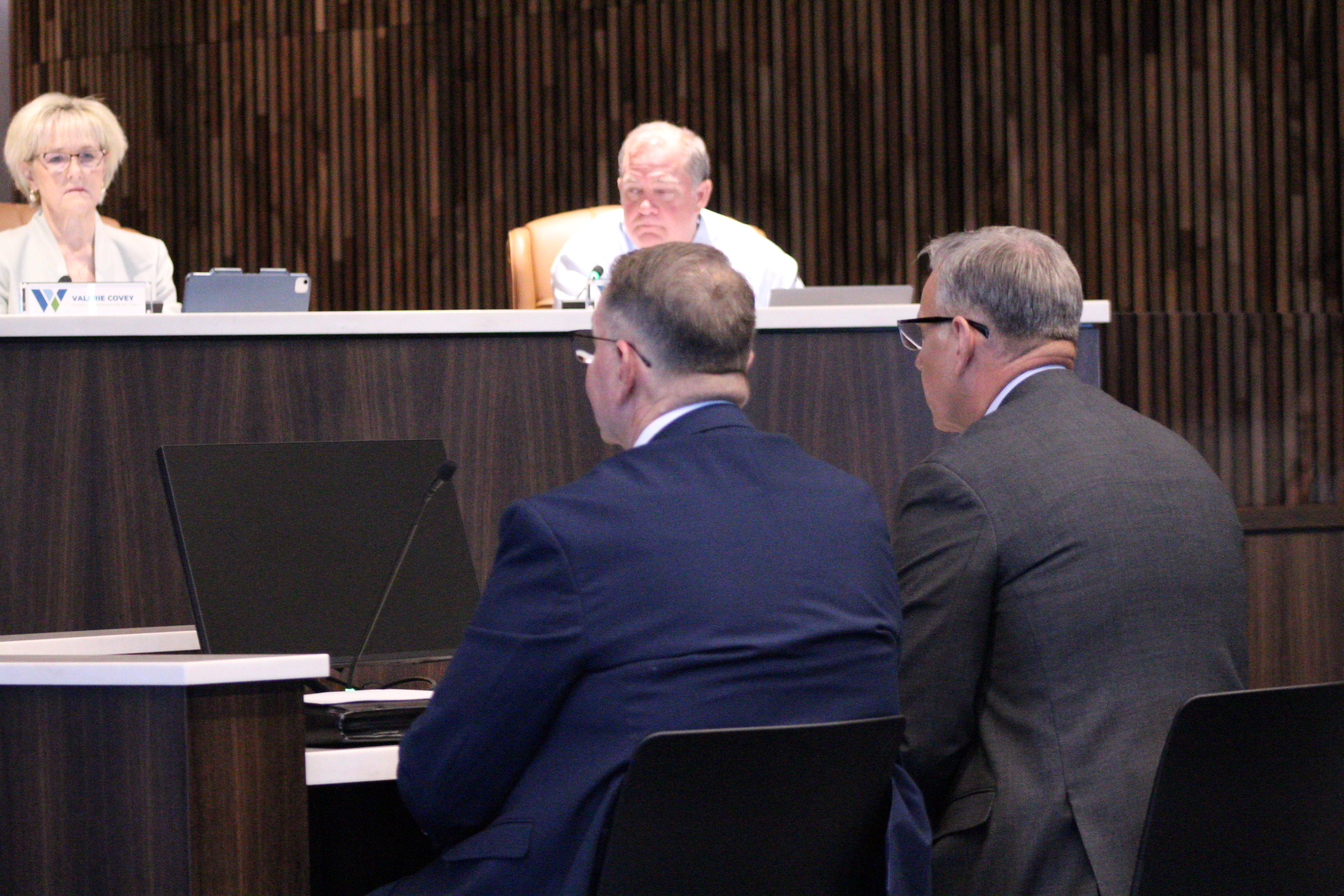 Commander John Foster, front right, and Detective David Boatright, front left, from the Williamson County Sheriff's Office explain how the Cold Case internship will benefit Williamson County during the October 21 Commissioners Court meeting. Photo by Nalani Nuylan.