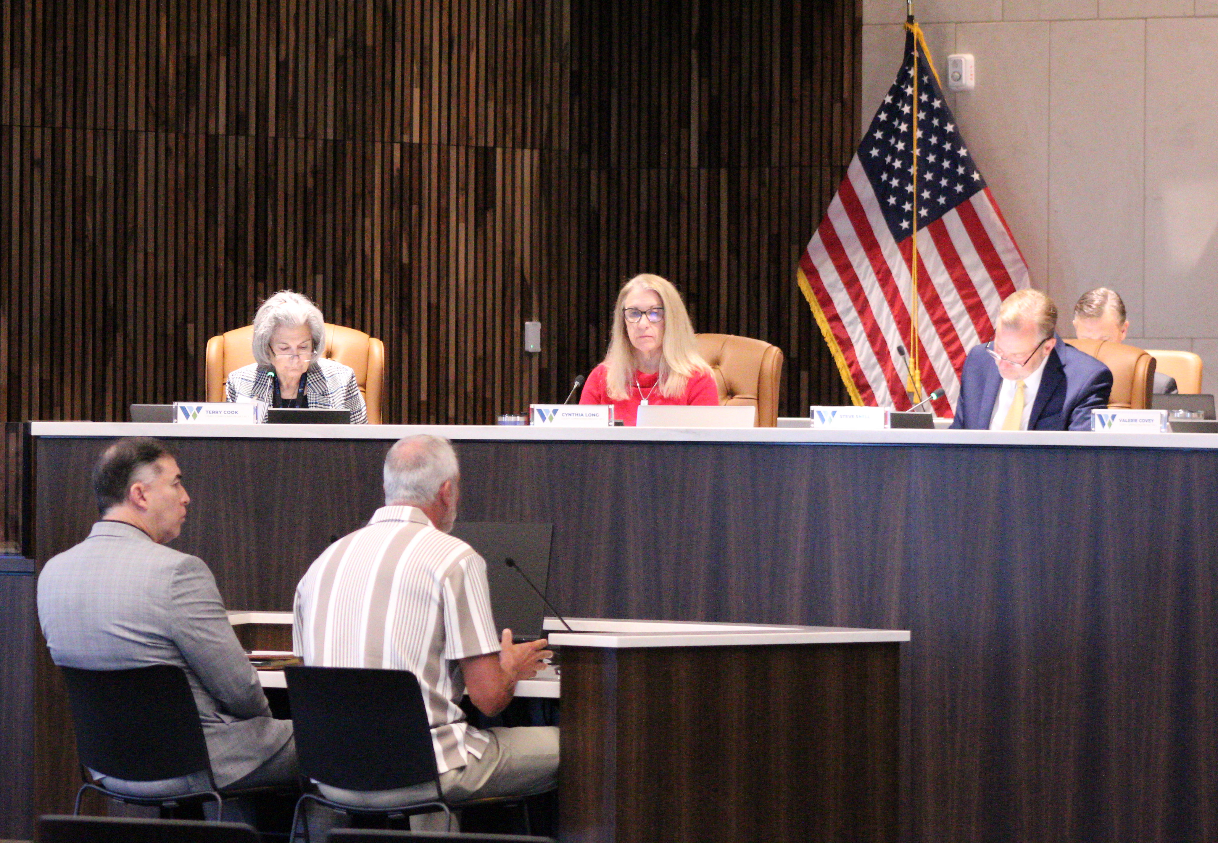 Scott Matthew, executive director of Williams County Juvenile Services, front right, and August Alvarado, director of District Court Administration, explain the Transformative Justice program to the Williamson County Commissioners, October 20. Photo by Nalani Nuylan.