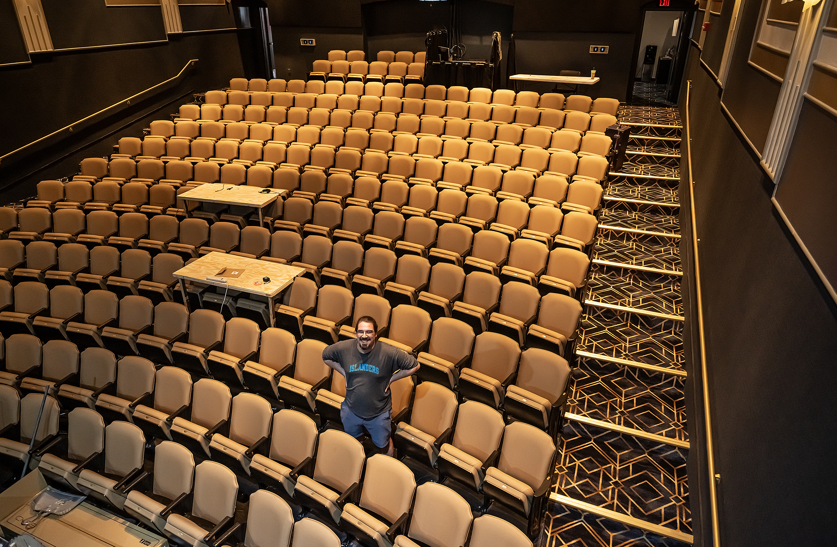 Morgan Taylor Myers, Director of Production at the Georgetown Palace, is surrounded by the new seating area at the historic theater on Tuesday, September 29. A late-January ice storm and flood decimated the seating area. After a few months the Springer Stage reopened, but with the old seats. The new seats await attendees for the Palace’s production of Oklahoma, which opens Friday, October 2, continuing through November 1. 