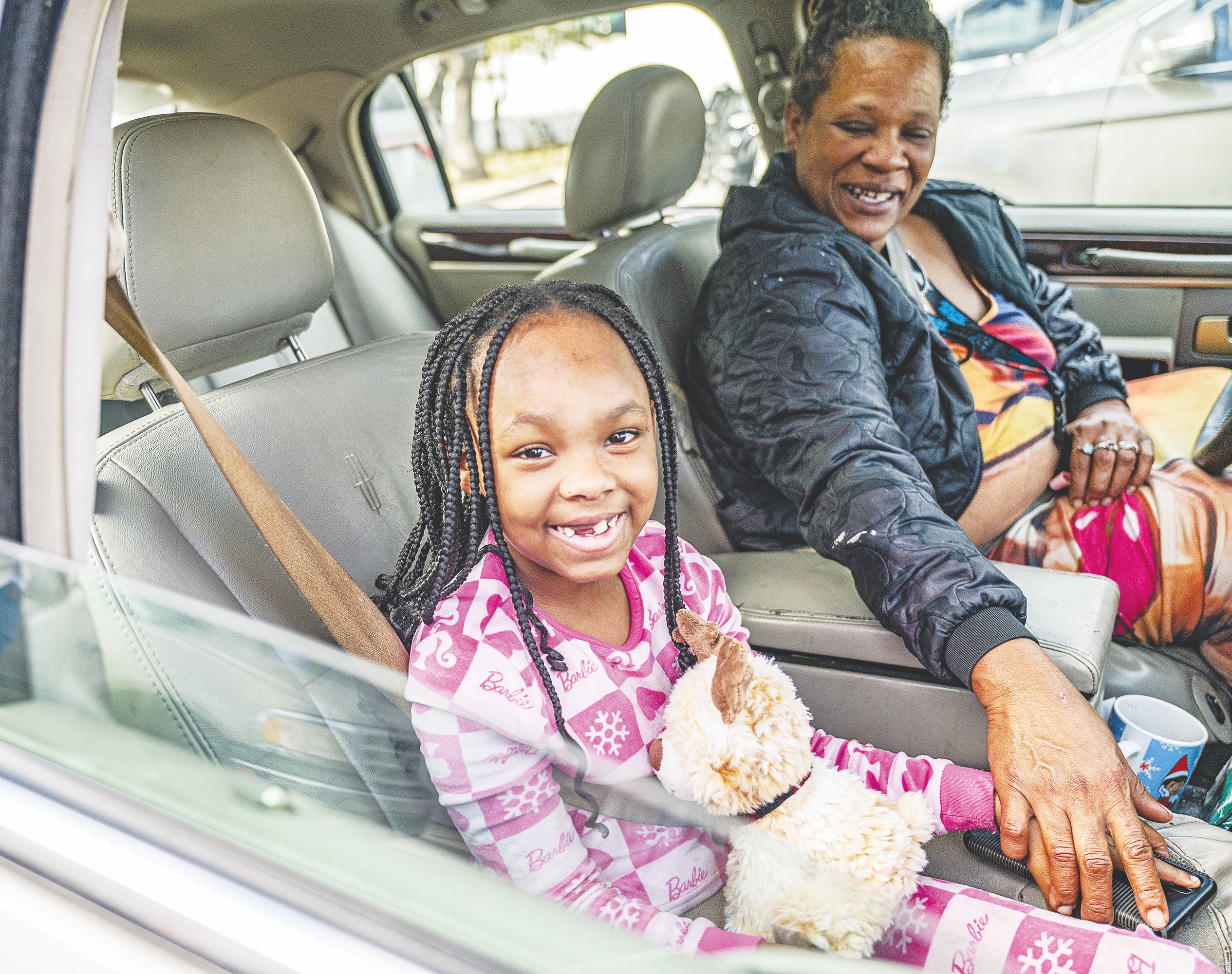 8-year-old  Ja’Nia Parker, with her mom Donna Bellard, was one of the many recipients  taking home gift boxes during the Georgetown Police Department’s annual Blue Santa distribution, held at the Georgetown Public Safety Center on DB Wood Road on Saturday, December 20. 