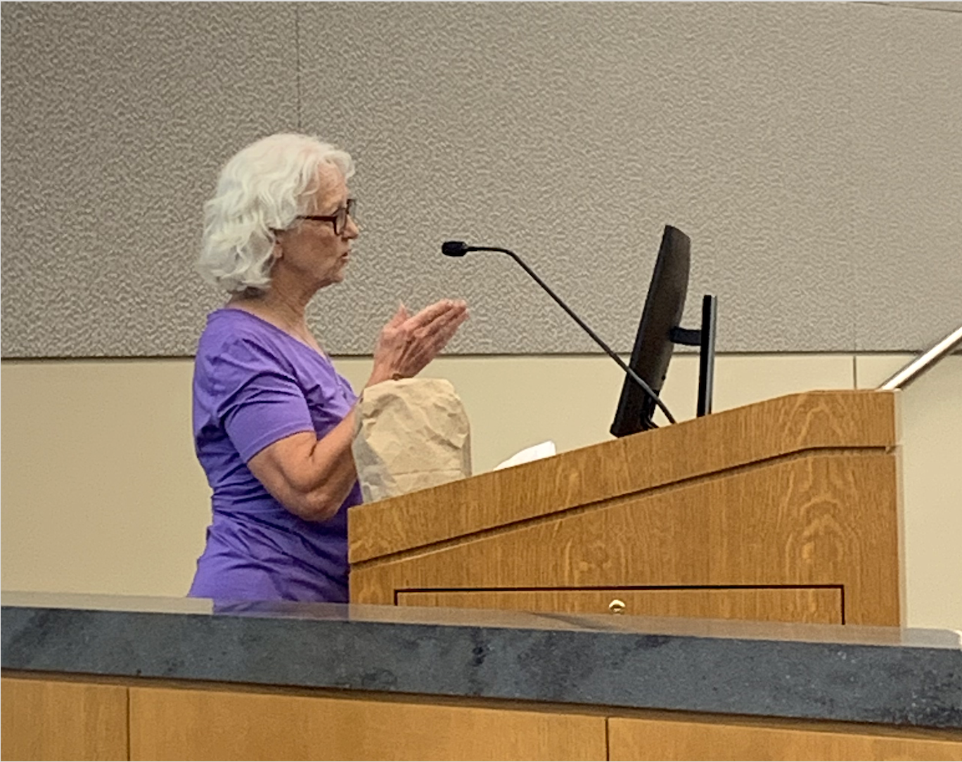 Resident Michelle Augustine expressed concerns about a parking ordinance affecting food distribution.