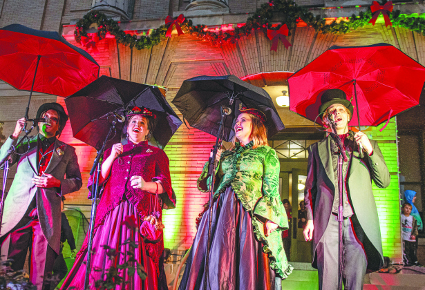The Uptown Carolers —including (from left) Steven Singleton, April Zink-Sellers, Katy Dennis-Bishop and Cameron Young — sang Christmas songs.