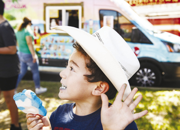 Josiah Sanchez, 5, enjoys a cool ice cream treat Saturday.