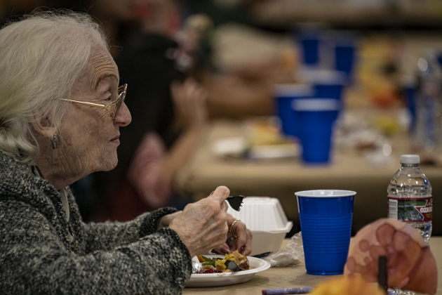Carol Ctvrtlik enjoys a meal with her son John.