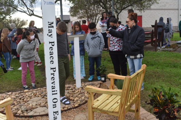Cooper students and art teacher Ginny Phillips check out their school's new Peace Garden.