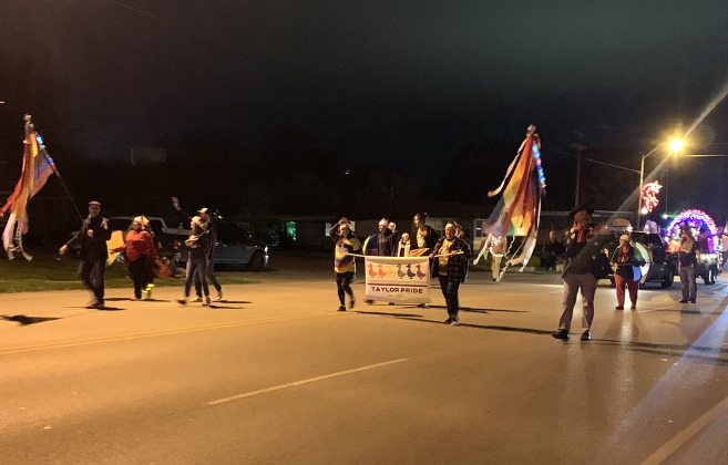 People representing Taylor Pride participate in the City of Taylor's Very Merry Holiday Parade December 3.
