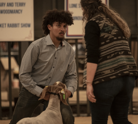 Canaan McQuade, 18, a member of the East View High School FFA program, shows his goat, Gram.