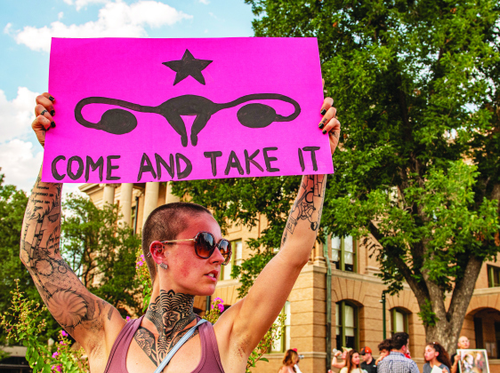 Abortion rights advocate Mindy Lowe holds her placard  during an abortion rights demonstration held at the square  on Sunday, July 10.