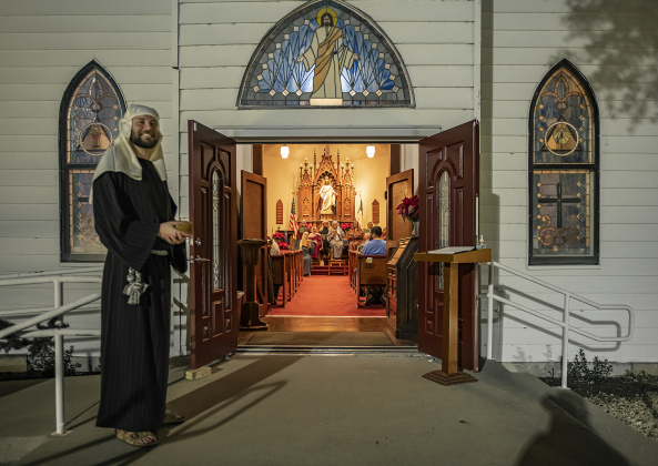 Pastor Caleb Bahr welcomes visitors to the sanctuary.