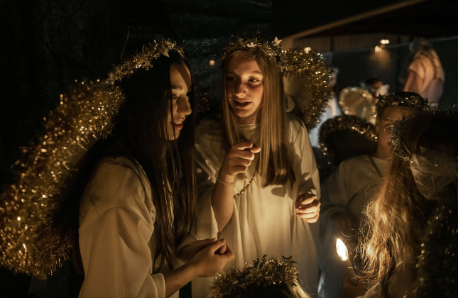 Angels, including Bailey Skrhak, left, and Kayla Pouncey both 13, wait to take their places as part of the manger scene.