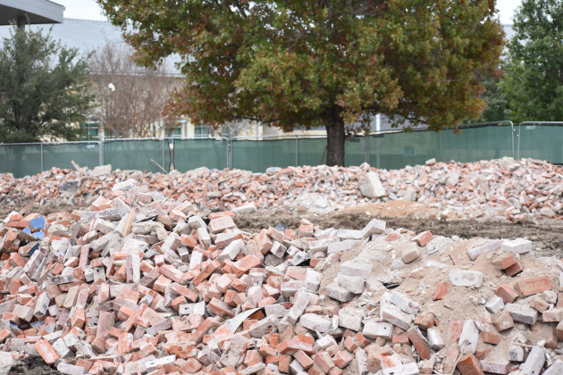 Piles of bricks are all that’s left of Jarrell ISD’s iconic 1916 Building. The district had planned to renovate, but engineers determined it was not structurally sound. The bricks will be used to construct an identical building. (Photo by Katherine Anthony)