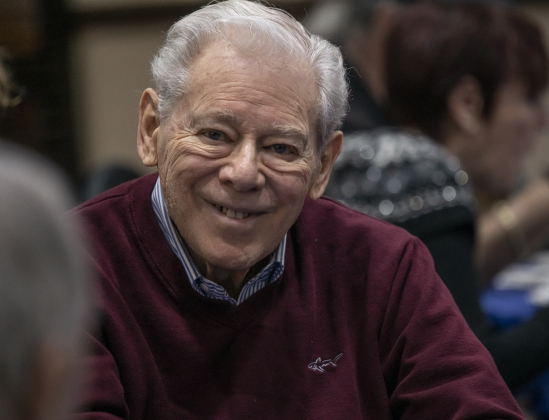Burton Anes visits with friends during a gathering of Congregation Havurah Shalom the first night of Hanukkah on Sunday, December 18, 2022.  The event  was held in Sun City.